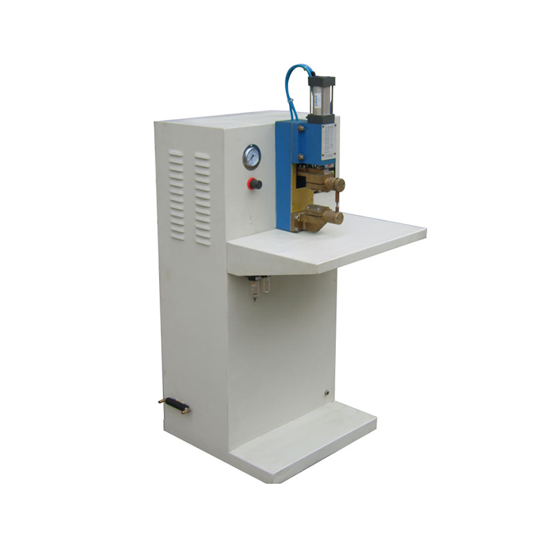 How does a spot welding machine achieve adaptive welding based on the properties of different metal materials through an intelligent control system?